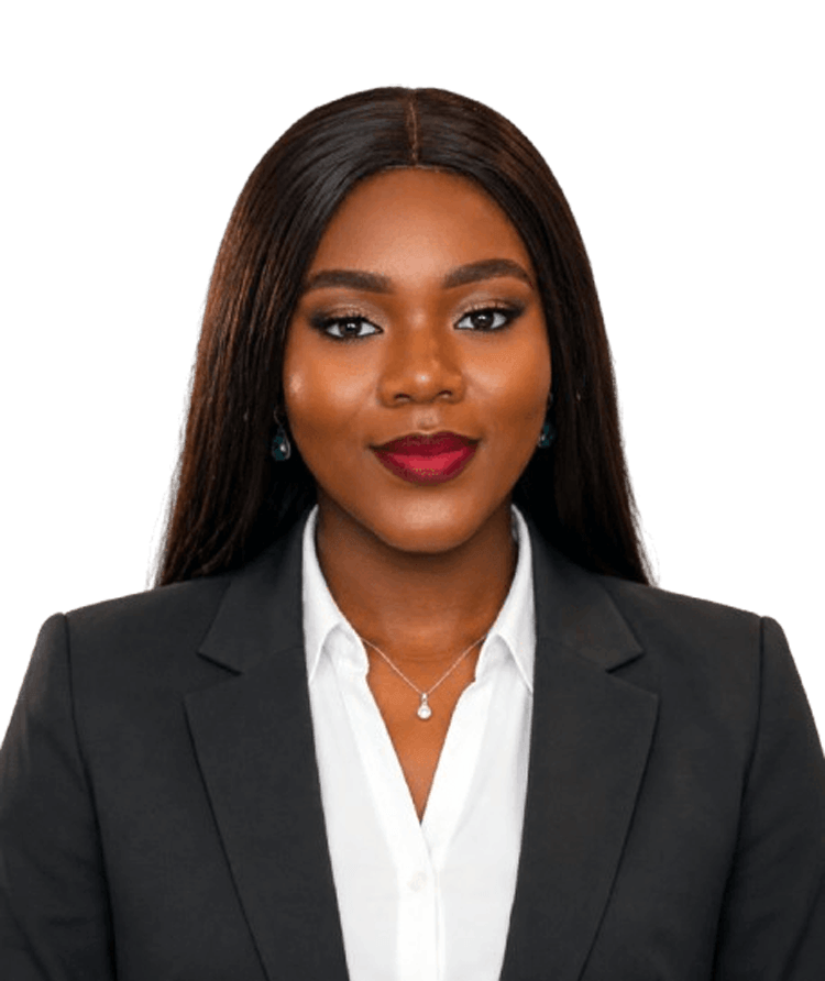 Professional woman in a black blazer and white blouse, smiling at the camera. head-and-shoulders portrait.